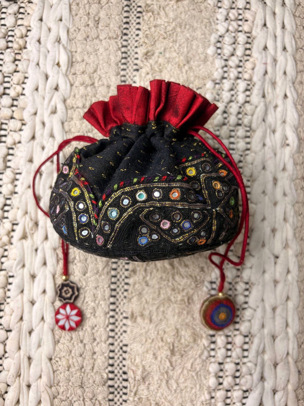 Black mirror-work potli for everyday elegance